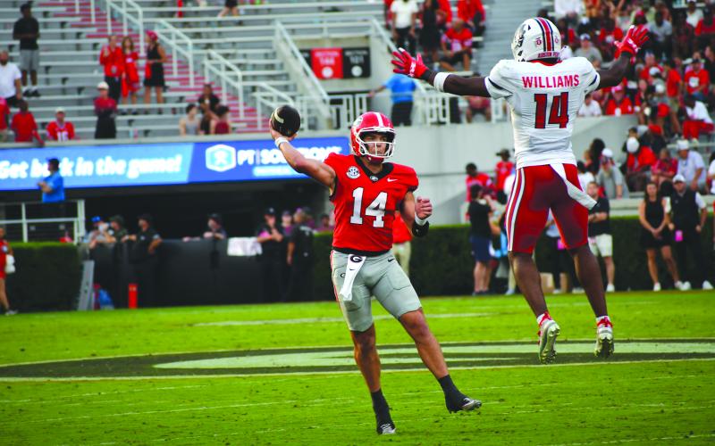 Wesley Branch/The Clayton Tribune. Former Rabun County and current UGA quarterback Gunner Stockton throws a pass versus Austin Peay in Georgia’s 28-6 win over the Governors on Sept. 6. Stockton threw for 227 passing yards in the game, completing 26-of-34 passes.
