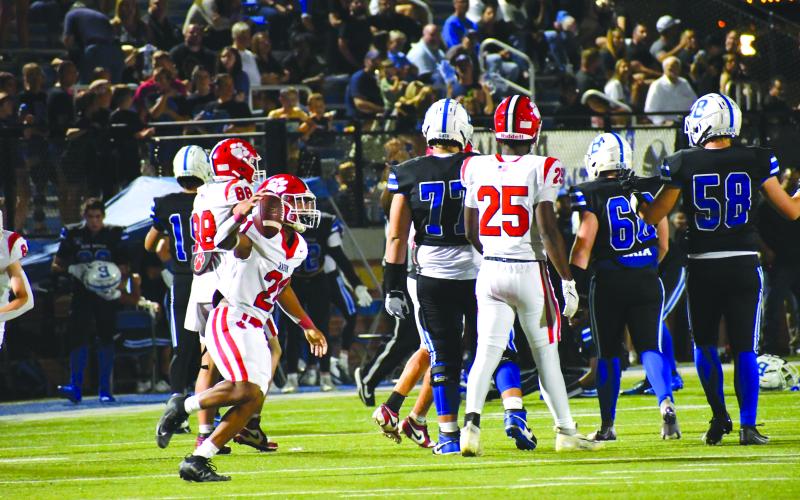 Wesley Branch/The Clayton Tribune. Rabun County senior defensive back Shaun Fruster (left) celebrates after intercepting Bremen quarterback Eli Brock in Rabun County’s 14-3 win on Sept. 12. The 4-0 Wildcats face Banks County Friday.
