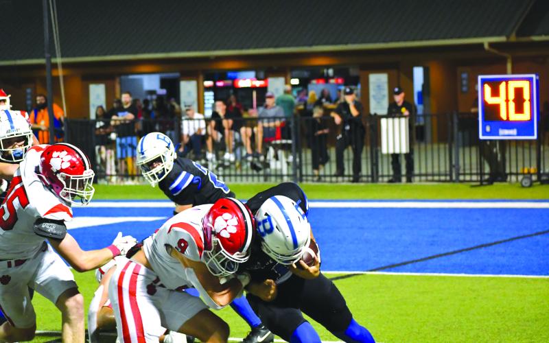 Wesley Branch/The Clayton Tribune. Rabun County sophomore linebacker Brock Brady and Bremen quarterback Eli Brock collide on a running play in the Wildcats’ 14-3 victory.