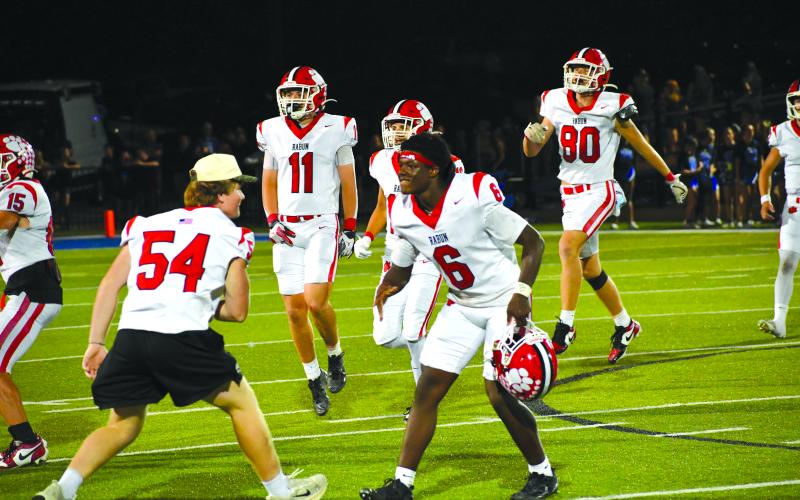 Wesley Branch/The Clayton Tribune.  Rabun County players celebrate as the clock winds down in the Wildcats’ 14-3 win over Bremen on Sept. 12. Rabun County now sits at 4-0 for the first time since 2022.