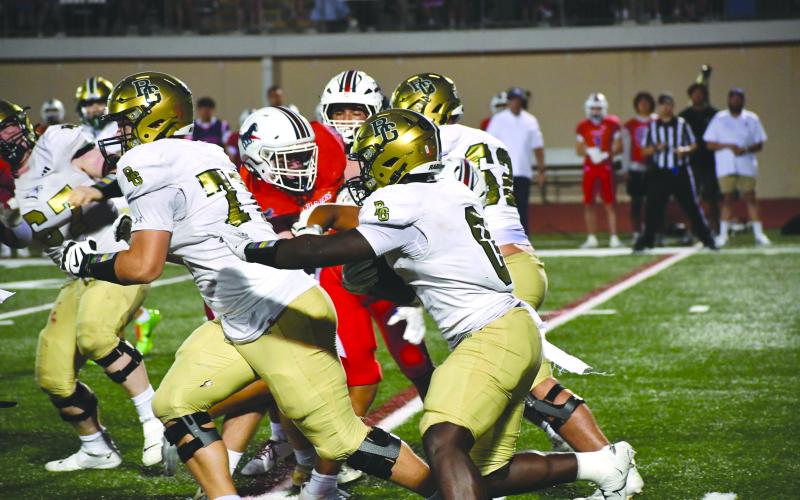 Wesley Branch/The Clayton Tribune. Rabun Gap sophomore running back Royce Djouguem navigates through Providence Day’s defense during the Eagles’ game versus the Chargers on Sept. 19. Djouguem scored his first touchdown of the season in the 55-34 loss.