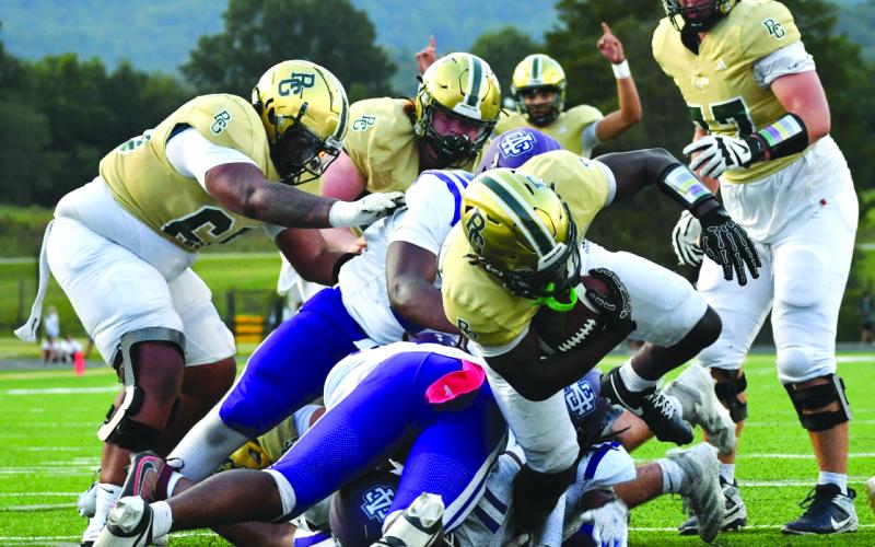 Enoch Autry/The Clayton Tribune. RGNS goes up 14-0 over Ambassador Christian in the first quarter as junior running back Jordan Lindo takes it into the end zone.
