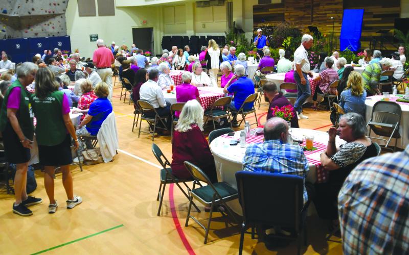 Enoch Autry/The Clayton Tribune. The room at the Clayton Baptist Church Ministry Activities Center was filled on Sept. 18 as the community donated toward the Place of Hope and the foster children the organization helps every week. The event raised $74,000.