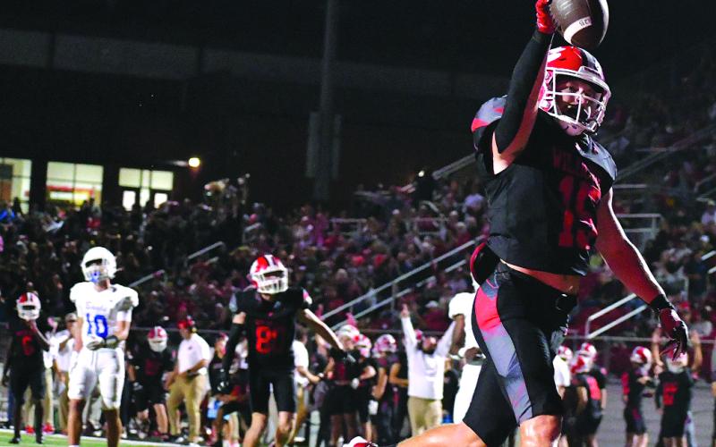 Enoch Autry/The Clayton Tribune. Senior Reid Giles goes in for his second receiving touchdown against Banks County as the Wildcats win 35-0. Standout Gunner Stockton had his No. 14 jersey retired in a pregame ceremony, and Hayden Bass won Homecoming Queen at halftime.