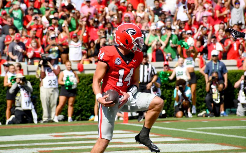 Wesley Branch/The Clayton Tribune. Georgia and former Rabun County QB Stockton celebrates in the end zone after his first TD of the season in the Bulldogs’ 45-7 win.