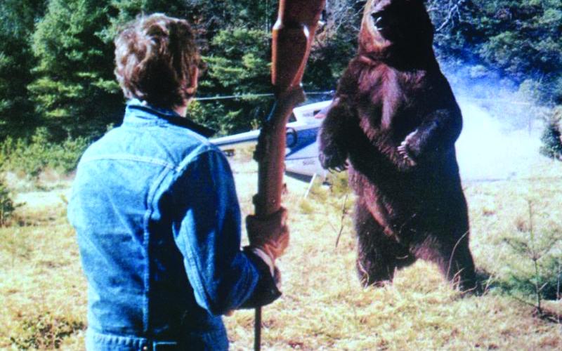 Submitted Photo. Andrew Prine battles the bear on the movie scene of “Grizzly” that was filmed in Clayton. The 1976 film will be shown at the Highlands-Cashiers Film Festival on Saturday, Sept. 20.