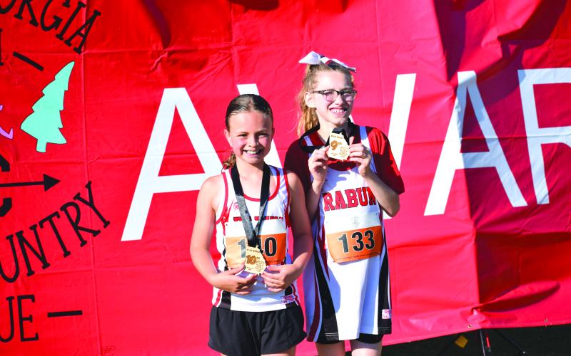 Submitted Photo. For the 10U girls, Madison Anderson finished in ninth place at 15:15, and Harper Westbrook finished in 10th at 15:18.