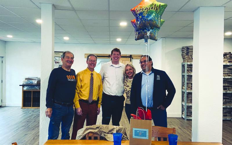 Katie Hamby/The Clayton Tribune. Steven Webster, 1 Mill Cups (from left); The Clayton Tribune Publisher Enoch Autry and Sports Editor Wesley Branch; and Kayla Flaherty and Bez Rengifo, 1MC, pose for photo as Tribune was honored. Not pictured, Tribune News Editor Megan Horn, Office Manager Katie Hamby and Senior Sales Associates Debbie Martin and Tony Penrose.