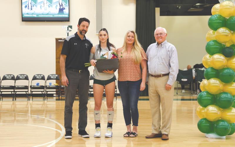 Wesley Branch/The Clayton Tribune. Tallulah Falls volleyball senior Becca Heyl (left center) and her father and head coach Matt Heyl (far left) on Senior Night, accompanied by Becca’s mother Coral Hulsey and President &amp; Head of School for TFS, Dr. Larry Peevy. The Lady Indians finished the regular season 24-8, securing their third region title in program history.
