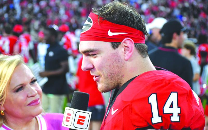 Wesley Branch/The Clayton Tribune. Georgia quarterback Gunner Stockton was interviewed by ESPN’s Holly Rowe after the Bulldogs’ 43-35 win over the Rebels of Ole Miss. Georgia will be back in action on Nov. 1 versus Florida in Jacksonville, Fla.