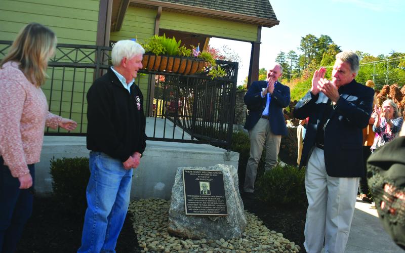 Enoch Autry/The Clayton Tribune. Jim Bleckley received an extra birthday surprise on Oct. 24 as the Rabun County Welcome Center was dedicated in his honor. Bleckley served as the county administrator for more than 24 years.