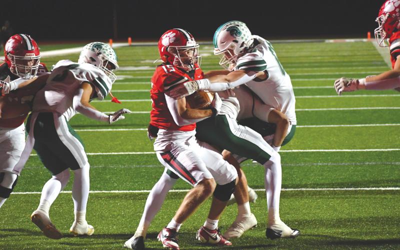 Wesley Branch/The Clayton Tribune. Rabun County senior Reid Giles fights off Athens Academy defenders for a touchdown run during Rabun County’s 49-46 loss on Friday, Oct. 24. Giles ended the game with 75 yards rushing, two touchdowns and an interception.