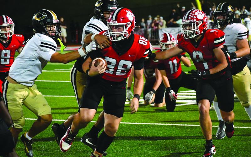 Enoch Autry/The Clayton Tribune. Senior Ethan Hopper runs into Commerce territory with a fumble recovery. Hopper also had a pick-six in the Oct. 3 region matchup.