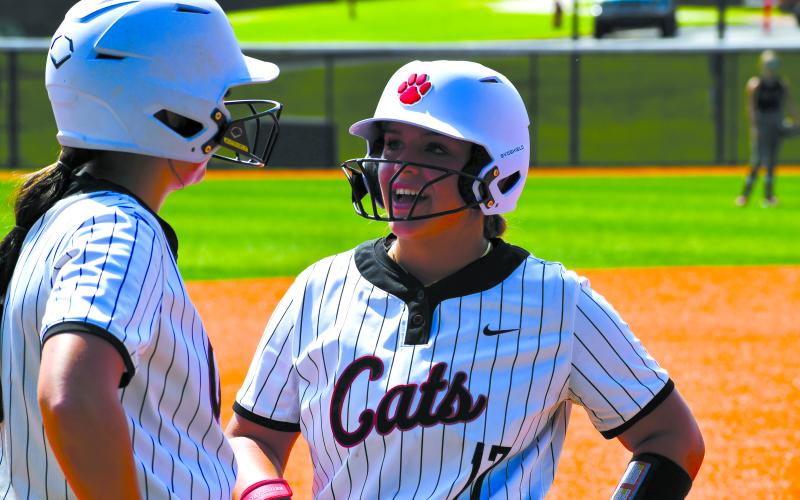 Wesley Branch/The Clayton Tribune. Rabun County Softball sophomore River Evans and senior Presley Burrell talk on third base during Rabun County’s 20-3 Aug. 16 win over Tallulah Falls. Both players earned all-region honors this season.