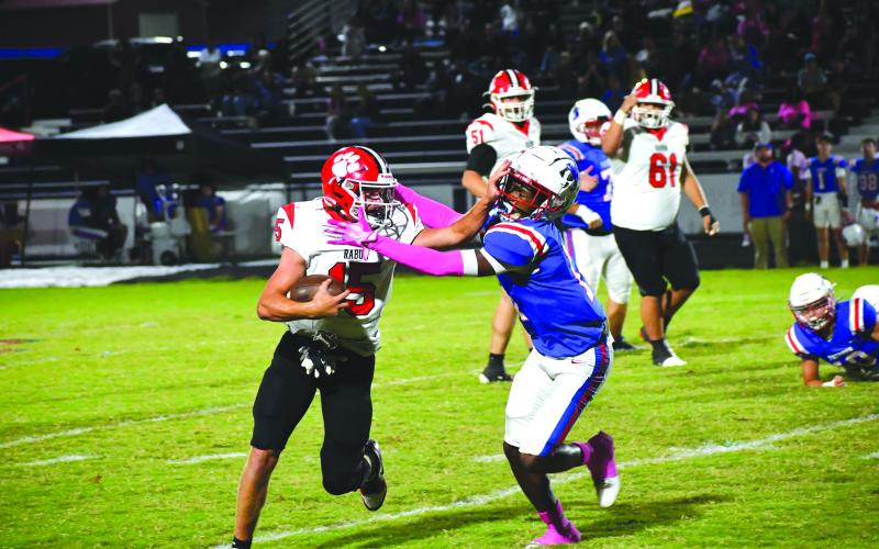 Wesley Branch/The Clayton Tribune. Rabun County running back Reid Giles stiff arms a defender in the Wildcats’ Oct. 10 game against the Patriots at Oglethorpe County. Giles finished the game with 109 total yards and a receiving touchdown.