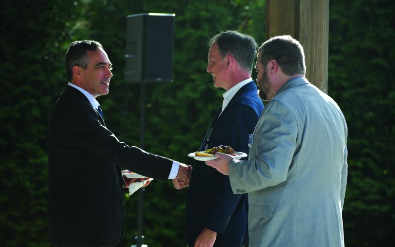 Enoch Autry/The Clayton Tribune. Democratic candidates Peter Hubbard, Bob Trammell and Clarence Blalock talk at the Blue BBQ at the civic center pavilions.