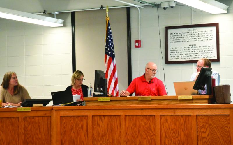 Enoch Autry/The Clayton Tribune. Clayton City Manager Trudy Crunkleton and Mayor Roy Quilliams look in the direction of City Attorney Mitch Baker during the Oct. 14 meeting at the Clayton City Hall. The Oct. 14 meeting was the first meeting with Quilliams as the city’s new mayor.