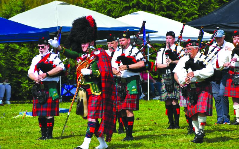 Enoch Autry/The Clayton Tribune. The Fraser Highlanders Pipe Band and with Col. Butch Teston performs Scottish music for the crowd at the Highlands Games on Sept. 27.
