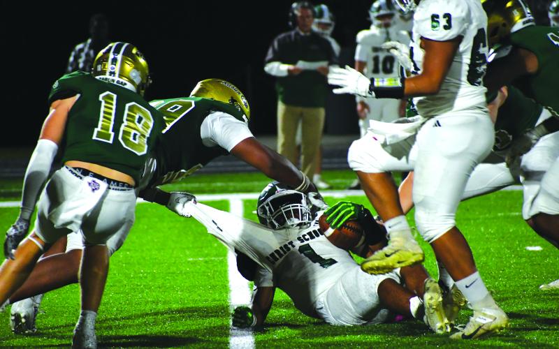 Wesley Branch/The Clayton Tribune. Rabun Gap sophomore defensive lineman Isaac Lukuni brings down a Christ School offensive player in the Eagles’ 42-0 win on Oct. 17 over Christ School. Lukuni had four tackles for a loss and a sack in the game.