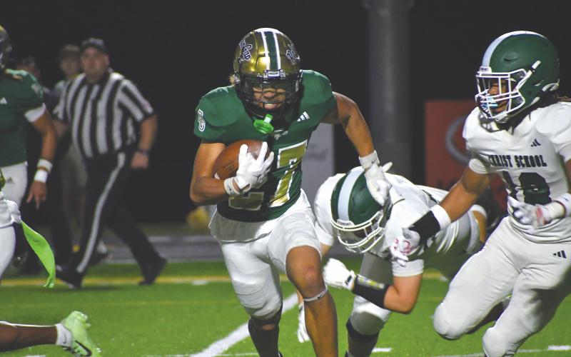 Wesley Branch/The Clayton Tribune. Rabun Gap sophomore defensive back Troy Dottin evades Christ School players after an interception in Rabun Gap’s 42-0 win over Christ School on Oct. 17. Dottin came away with his first interception of the season in the game.