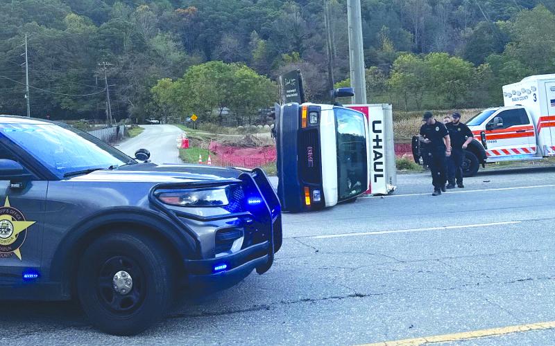 Photo courtesy Kinley Burtch. The U-Haul box truck reportedly driven by a female suspect from Dunwoody, Ga., is turned on its side in Mountain City after the driver was pursued law enforcement on Oct. 18. The pursuit started in Franklin, N.C.