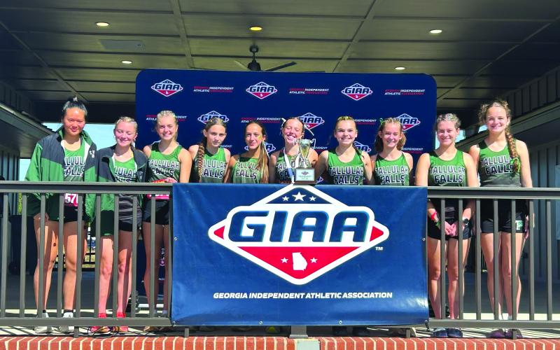 TFS Athletics/The Tallulah Falls girls cross country team shows their state runner-up trophy they claimed in Macon.