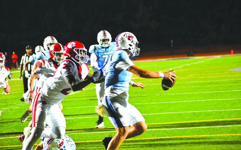 Wesley Branch/The Clayton Tribune. Rabun County defensive lineman Takeo Hibler brings down Providence Christian Academy quarterback Riley Braiden for Hibler’s first sack of the season in the Wildcats’ 62-21 win over the Storm.