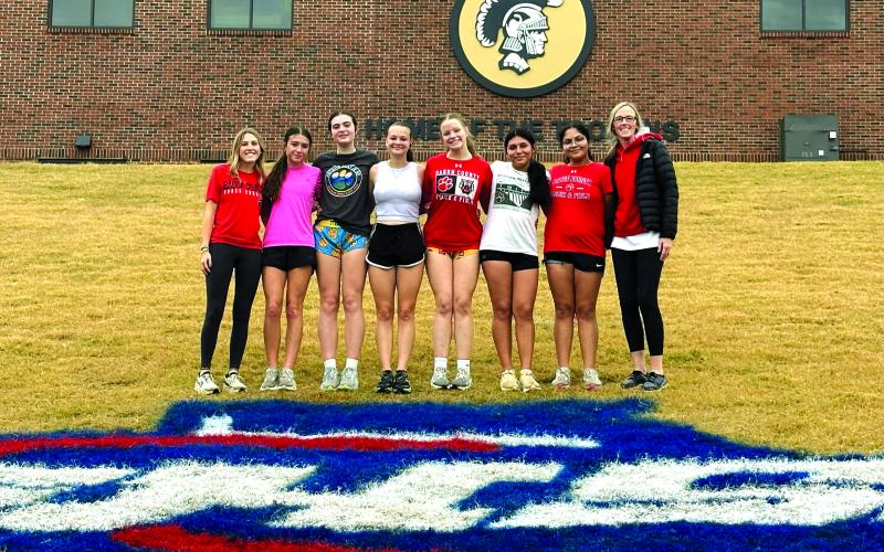 Submitted. The Lady Cats pose for a team photo with head coach April Adcock before the Nov. 8 race.