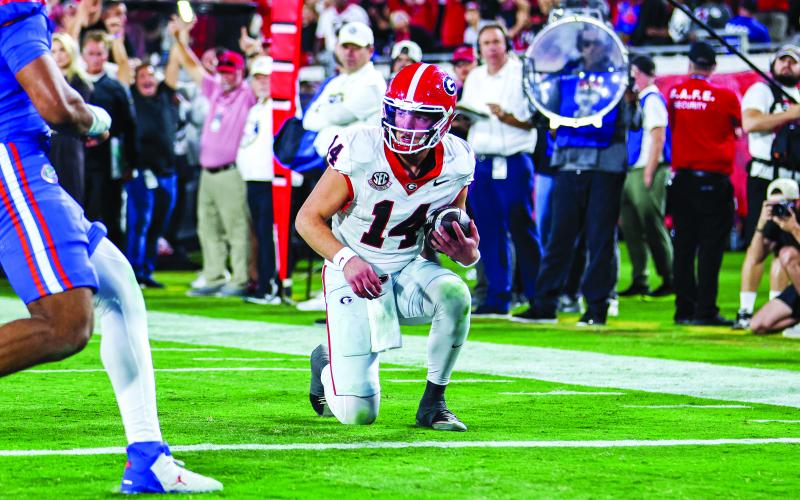 Conor Dillon/UGAAA. Current Georgia and former Rabun County quarterback Gunner Stockton takes a knee at the 1-yard line to clinch a 24-20 victory for the Bulldogs over their arch rival Florida Gators on Nov. 1. Georgia has beaten Florida five consecutive years, including this season.