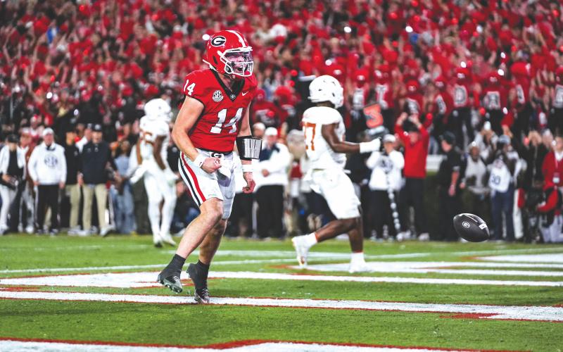 Tony Walsh/UGAAA. Former Rabun County and current Georgia quarterback Gunner Stockton celebrates in the end zone after a rushing touchdown in the Dawgs’ 35-10 win over Texas. Stockton accounted for all five of UGA’s scores.