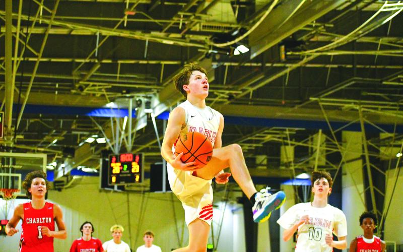 File Photo/The Clayton Tribune. Rabun County’s senior guard Huey Blalock goes in for a bucket. The RCHS boys are a state preseason No. 3.