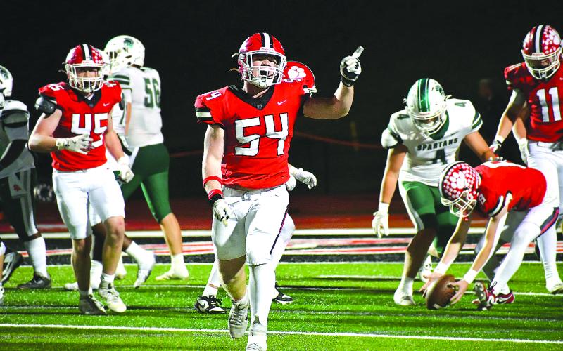 Enoch Autry/The Clayton Tribune.  Rabun County will host Dodge County in the first round of the state playoffs on Friday, Nov. 14, at Frank Snyder Memorial Stadium. Here junior defensive lineman Ryan Yearwood (54) celebrates after the Wildcats make a stop against Athens Academy at home on Oct. 24.