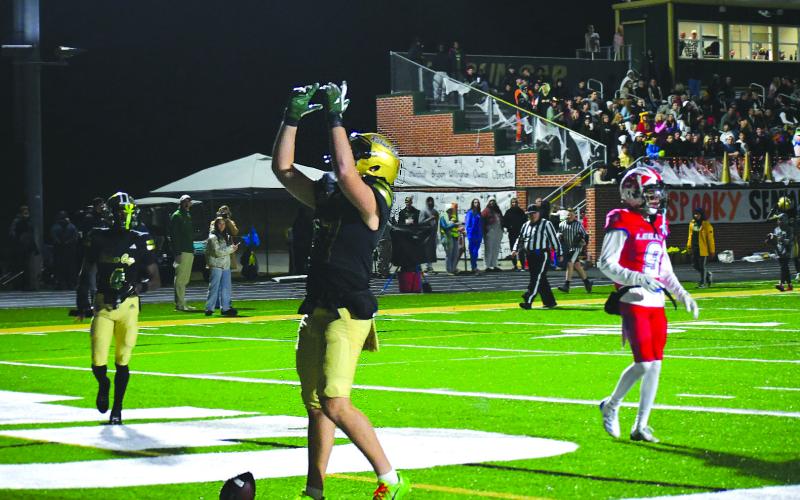 Enoch Autry/The Clayton Tribune. Rabun Gap sophomore tight end Cash Washburn points to the sky after catching a touchdown pass against visiting Legacy Sports Agency.