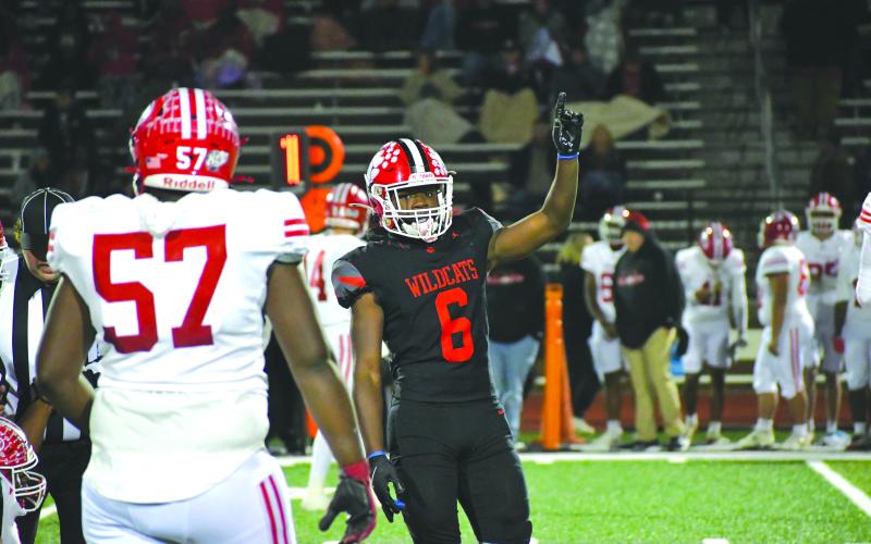 Wesley Branch/The Clayton Tribune. Junior outside linebacker JK Fruster celebrates a defensive stop by Rabun County in the Wildcats’ first-round 56-21 win over visiting Dodge County on Nov. 14. In the game, Fruster blocked a punt and scooped it up and raced 47 yards to the end zone for a score.