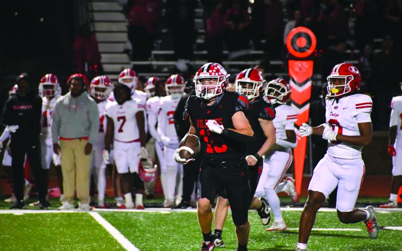 Wesley Branch/The Clayton Tribune. Rabun County senior Reid Giles returns an interception against Dodge County on Nov. 14 in the Wildcats’ 56-21 playoff win over the Indians. Rabun County hosts Berrien on Nov. 21 for the second round of the Class A Division I playoffs.