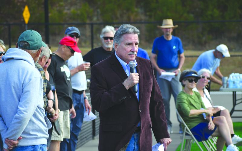 Wesley Branch/The Clayton Tribune. Chair of the Rabun County Commission Greg James addresses the crowd at the Pickleball court dedication in Tiger on Nov. 19. James shared his excitement for the project and view on how public-private funding works.