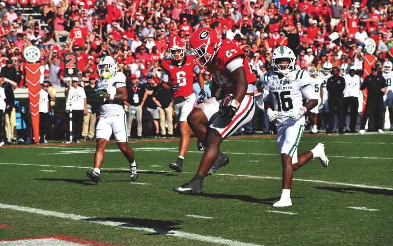 Wesley Branch/The Clayton Tribune. Georgia freshman and former Rabun Gap running back Bo Walker leaps into the end zone for his second touchdown of his career and of the game in Georgia’s 35-3 win over Charlotte on Nov. 22.