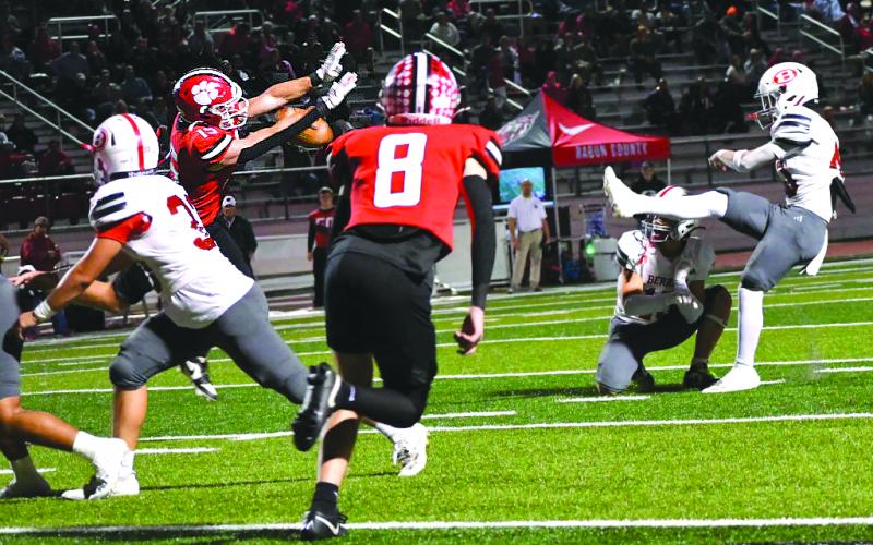 Enoch Autry/The Clayton Tribune. Reid Giles blocks a field goal attempt.