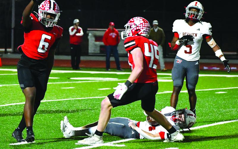 Wesley Branch/The Clayton Tribune. JK Fruster (6) celebrates his quarterback sack.