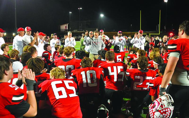 Enoch Autry/The Clayton Tribune. Coaches, support staff and Wildcat players applaud Rabun County head coach Rance Gillespie’s approval that RCHS is one of eight teams remaining in the Class A Division I playoffs. Gillespie said the team has embraced being “EL1TE” and now the Wildcats have reached the Elite Eight and will play after Thanksgiving.