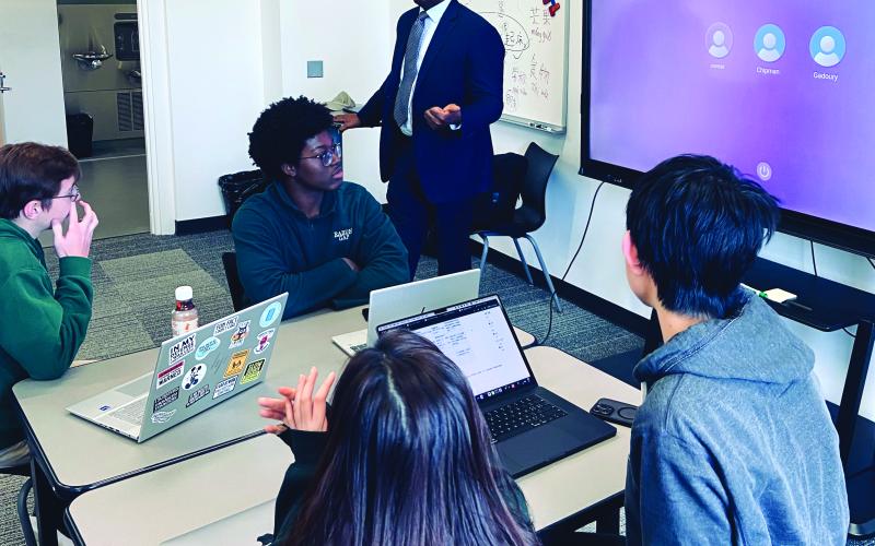 Submitted Photo. Rabun Gap-Nacoochee School teacher Dr. Mason West instructs his AP Economics class. West’s students will present their “Learner Snapshot” app to members of 1 Million Cups at a Dec. 10 meeting at the school.