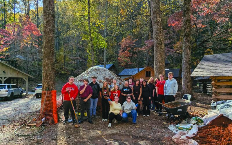 Submitted Photo. The full RCHS group poses for a photograph at Cherokee mud house on the Foxfire Museum property.