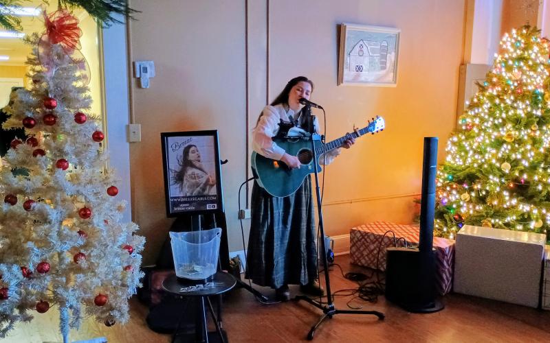 Megan Horn/The Clayton Tribune. Breeze Cable performs in the Ebenezer VIP Lounge at the Dec. 13 “Dickens in Dillard” Christmas Festival.