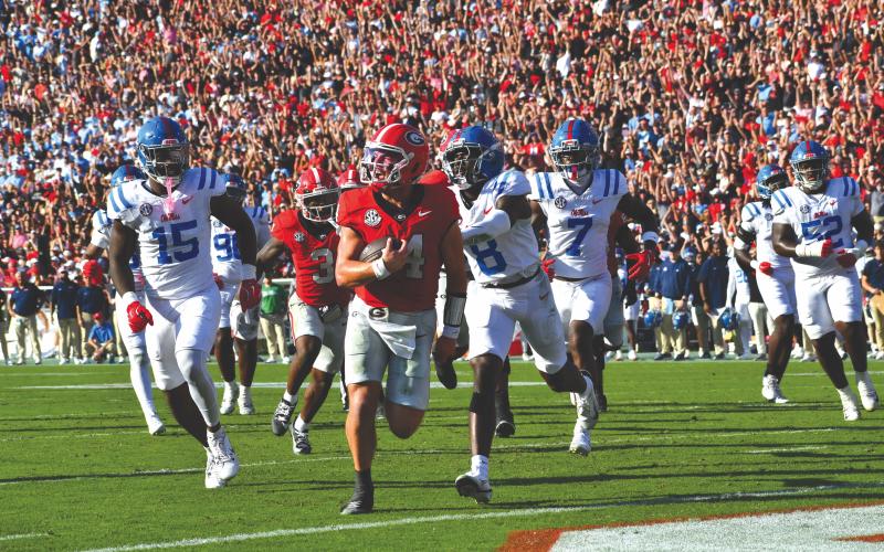 Wesley Branch/The Clayton Tribune. Former Rabun County and current UGA quarterback Gunner Stockton strolls into the end zone for a rushing touchdown in Georgia’s 43-35 win over Ole Miss on Oct. 18. Last week, it was announced Stockton finished seventh in the 2025 Heisman Trophy voting.