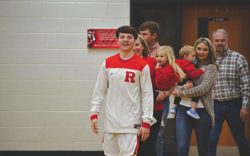 Wesley Branch/The Clayton Tribune. Rabun County senior Huey Blalock is escorted by his family on Senior Night against Towns County. Blalock recently announced his verbal commitment to continue his playing career at the Naval Academy.