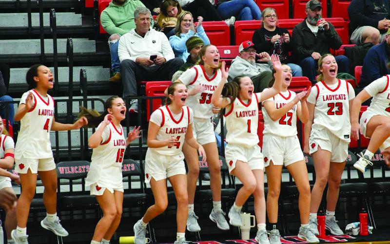 Enoch Autry/The Clayton Tribune. Rabun County Lady Cats celebrate when teammate senior Chloe Shirley scores in the fourth quarter of the girls’ win over East Hall on Dec. 5 at home.