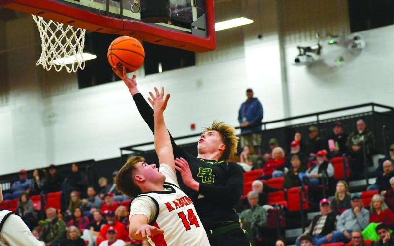 Wesley Branch/The Clayton Tribune. abun Gap junior Joonatan Tartu shoots over Rabun County freshman Cord Burrell for a contested layup against Rabun County on Dec. 19. Rabun County took the win 64-59, improving to 9-1 while Rabun Gap fell to 10-5.