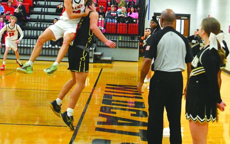 Enoch Autry/The Clayton Tribune. Senior Colton Crane attempts to slap the ball onto the body of East Hall’s Koen Bryant so the Wildcats can retain possession in their victory over the Vikings.