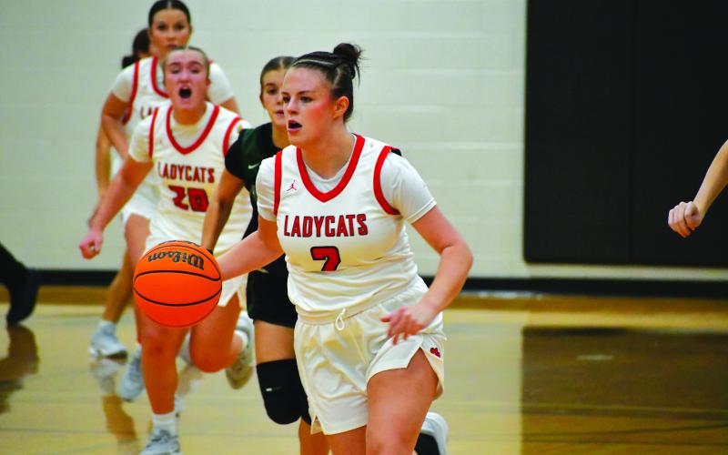 Wesley Branch/The Clayton Tribune. Rabun County junior guard Adelyn Thompson dribbles down the court in the Lady Cats’  53-45 win over North Hall on Nov. 25. Thompson scored 10 points and added two assists in the victory over the Trojans.