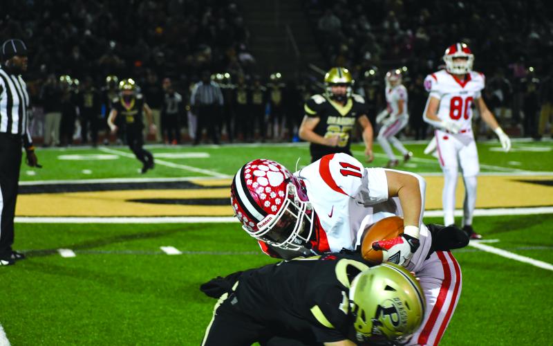 Wesley Branch/The Clayton Tribune. Rabun County wide receiver Reed Burrell attempts to shed a Pepperell tackler in Rabun County’s state quarterfinal loss to Pepperell. Burrell led the Wildcats in receiving with 48 yards on four receptions.